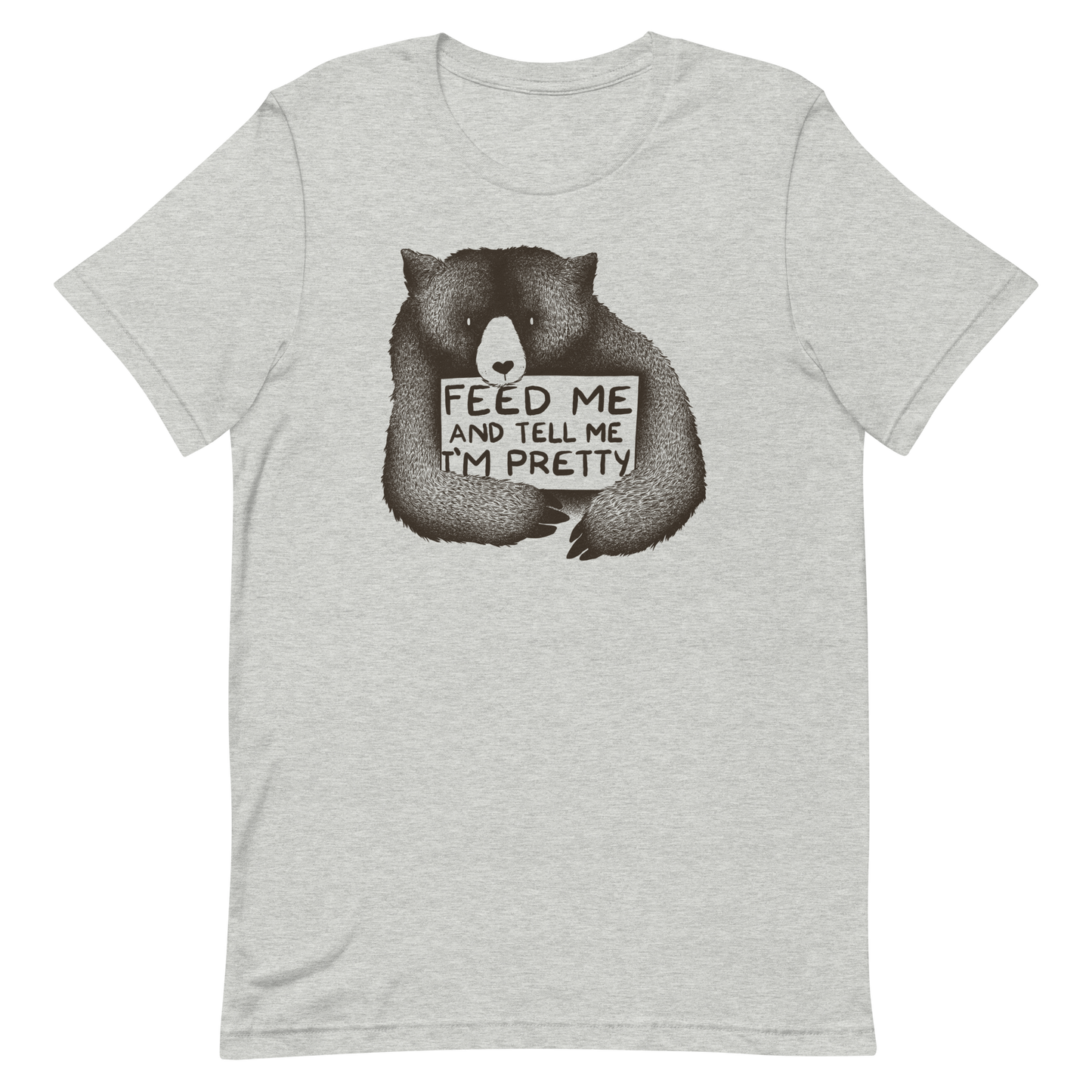 This drawing is of a cute, cartoon-style bear holding a sign with a heart-shaped nose and simple, expressive eyes. The sign reads, 'Feed me and tell me I'm pretty' in a handwritten, playful font. The bear's fur is detailed with fine, textured lines, giving it a cozy, endearing look. The drawing has a monochrome, black-and-white color scheme