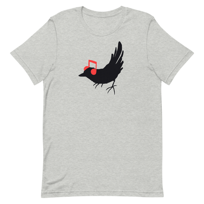 The drawing is a black silhouette of a bird in profile, standing on the ground, with bright red musical notes positioned like headphones over its ears, creating a whimsical and playful contrast. The drawing is simple, using solid colors and minimal details, giving it a modern and fun feel suitable for various merchandise like t-shirts, stickers, coffee cups, and skateboards.