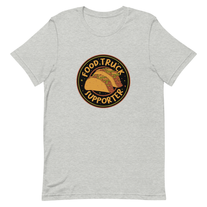 Two delicious tacos sit at the center of a bold circular badge under the phrase “Food Truck Supporter”. This design celebrates the love for street food and the joy of discovering amazing flavors on wheels. Perfect for foodies, taco lovers, and anyone who proudly supports their local food trucks.