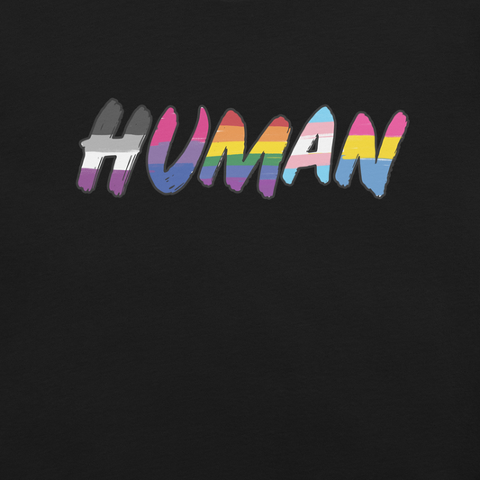 The image displays the word 'HUMAN' in bold, capitalized letters filled with colorful pride flag patterns. The colors within the letters represent different LGBTQ+ pride flags, symbolizing inclusivity and diversity. The background is solid black, which makes the colorful patterns stand out more vibrantly.