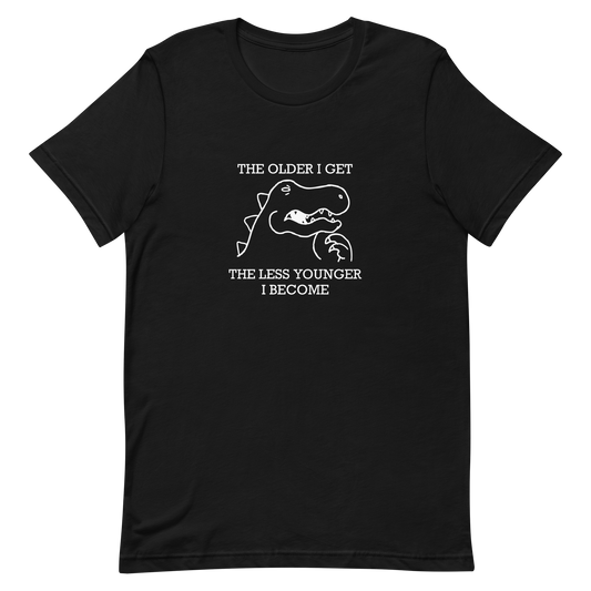 This artwork features a simple line drawing of a dinosaur with a thoughtful expression and the phrase “The older I get the less younger I become”. It playfully captures the humor of aging, mixing sarcastic wisdom with a quirky cartoon style. Perfect for fans of funny quotes, dinosaur lovers, and anyone who appreciates ironic and lighthearted designs.
