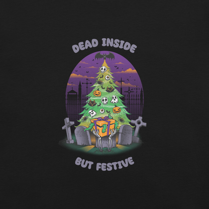 A quirky illustration features a Christmas tree decorated with skulls, pumpkins, and bats, set in a graveyard. The sky is purple and orange, with bats and tombstones surrounding the tree. A skeleton hand holds a festive gift box at the base. Above, text reads "Dead Inside" and below, "But Festive". The design combines Halloween and Christmas elements in a humorous style, highlighting a gothic and festive theme.