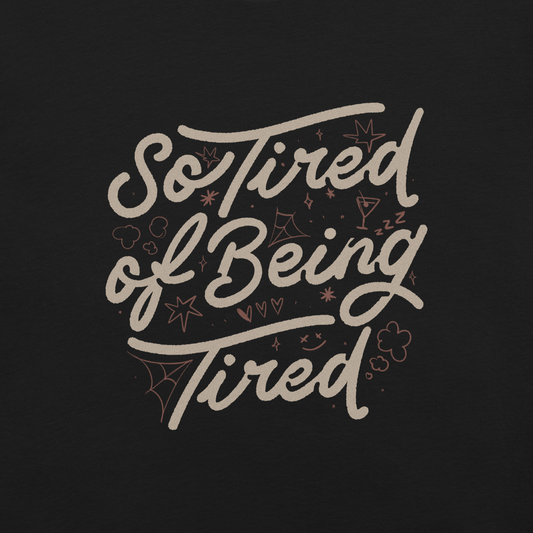 The artwork features the retro-style lettering "So Tired of Being Tired" surrounded by small icons like stars, hearts, clouds, and spider webs. This composition expresses the feeling of constant fatigue in a fun and stylish way. Ideal for those who bring humor to life and those who experience exhaustion in a lighthearted and humorous way.