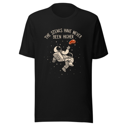 An astronaut floating through space with a small steak in front of him, paired with the phrase ‘The Steaks Have Never Been Higher’. A playful and humorous design that blends space exploration with a clever visual pun. Perfect for fans of witty wordplay and quirky art.