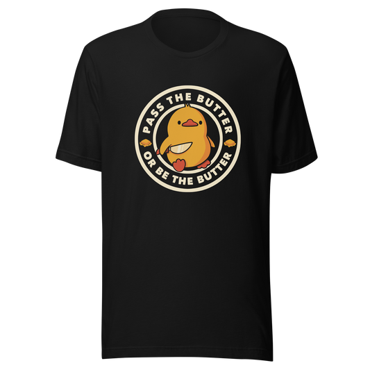 A yellow duckling holding a butter knife in a cute pose, around him the phrase "Pass the butter or be the butter". An art with a lot of humor for those who love ducks.