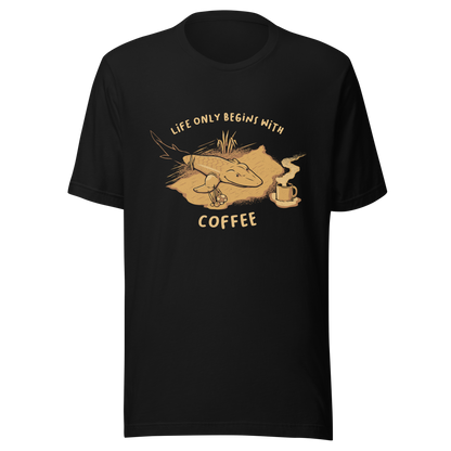 This funny illustration shows a tadpole evolving into a terrestrial creature while reaching for a cup of coffee. Paired with the phrase ‘Life Begins After Coffee Evolution’, the artwork humorously compares human evolution to our daily need for coffee.