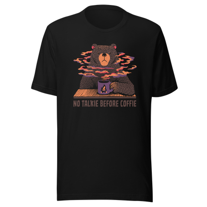 A large brown bear holding a purple coffee cup with a campfire design, with steam rising as if the coffee were piping hot. Below it appears the phrase ‘No Talkie Before Coffie’. A fun design for coffee lovers and anyone who isn’t ready to talk before their first cup.