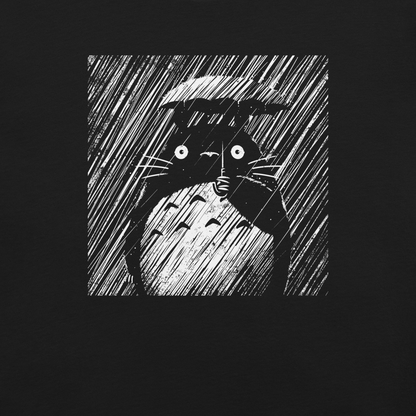 A large forest spirit stands still in the rain, holding a tiny umbrella while soaking in the storm. This black and white design captures a quiet, emotional moment with a vintage, textured style.