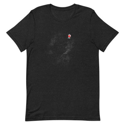 The image depicts a lone astronaut floating in outer space, seemingly sitting on nothing while holding a large, bright red heart. The background is a starry expanse of black, suggesting the vastness and cold emptiness of space. The stark contrast between the dark space and the vibrant heart symbolizes love and loneliness in the cosmos.