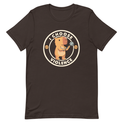 A cute, cartoonish burnt yellow capybara stands holding a spiked mace with a determined expression. Surrounding it is a circular design with the text 'I CHOOSE VIOLENCE' and two small skulls on either side, giving it a humorous yet ironic tone.