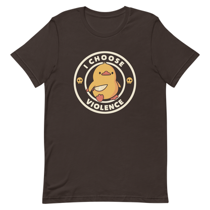 A cute, cartoon-style yellow duckling stands confidently holding a large knife in its wing. The duckling is encircled by text saying 'I CHOOSE VIOLENCE' in bold white letters. Small skull symbols flank the chick on either side, adding a touch of humor and irony to the otherwise adorable drawing.