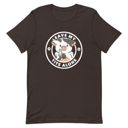 A quirky stamp-style design featuring a cute spotted cow holding a knife with the phrase “Leave My Tits Alone.” It mixes humor, attitude, and a playful call for animal respect. Perfect for cow lovers, fans of sassy humor, and anyone who supports animal rights.
