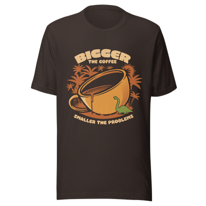 A giant retro-style coffee cup, with a little dinosaur strolling around and palm trees in the background. This design plays on the phrase "Bigger the coffee, smaller the problems," creating a cute and humorous scene about morning survival. Perfect for coffee lovers, dinosaur fans, and those who enjoy fun art.
