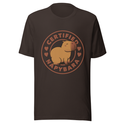 An art piece in warm beige and brown tones featuring a relaxed, sleepy capybara sitting peacefully beside the phrase “Certified Napybara”. A cozy, humorous design perfect for anyone who relates to slow days, loves capybaras, and fully embraces the art of taking naps.
