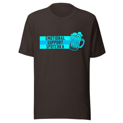 The design features a stylized mug filled with a frothy beverage, colored in vibrant shades of blue. Next to the mug, bold text reads 'EMOTIONAL SUPPORT SPOTCHKA'. The use of color and font style gives it a playful, pop-culture vibe, hinting at something fantastical or sci-fi influenced.