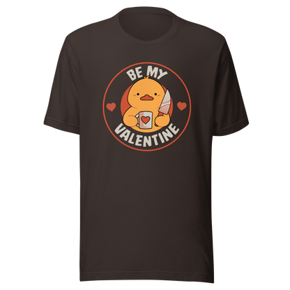 A cute duckling holding a heart-shaped coffee mug and a small knife, paired with the phrase ‘Be My Valentine Funny Duck’. A playful mix of cuteness and dark humor, perfect for coffee lovers and fans of ironic, quirky art.