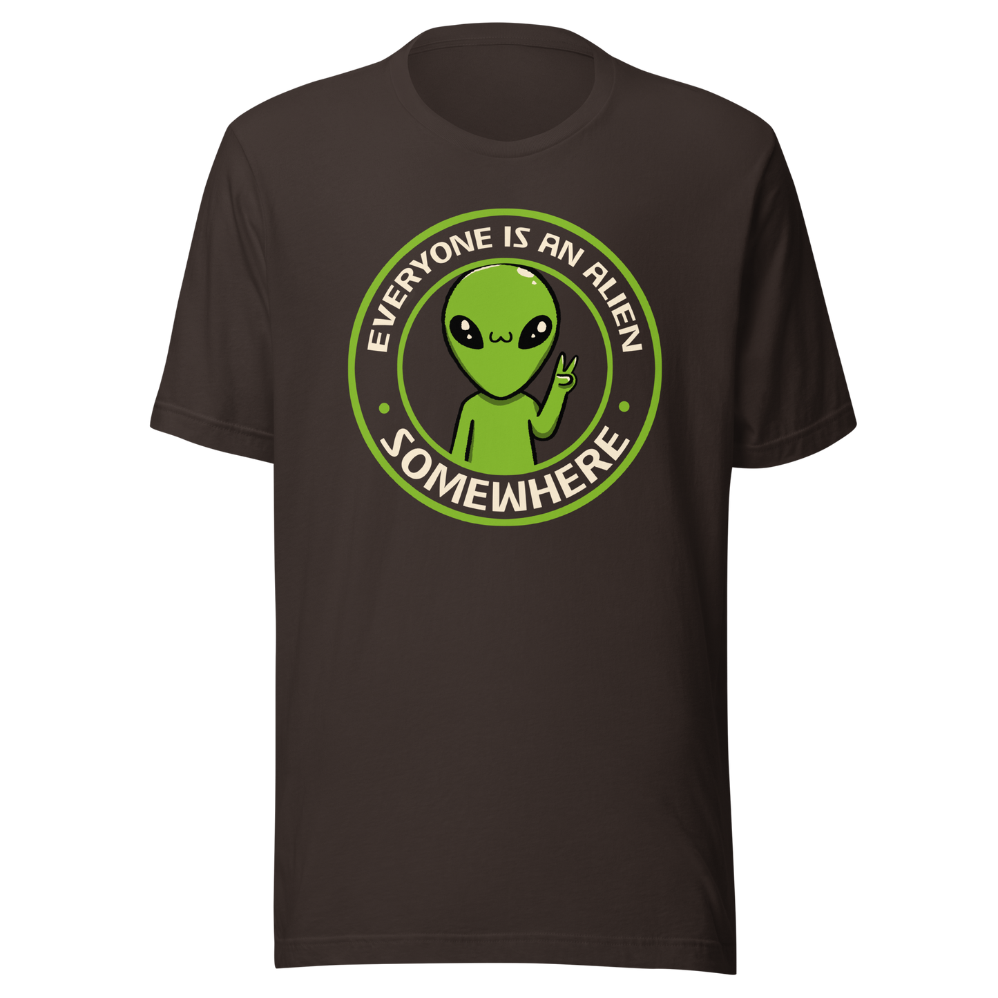 A stamp-style design of a green alien making a “V” sign, paired with the phrase “Everyone Is An Alien Somewhere”. A playful artwork about feeling different and embracing individuality.