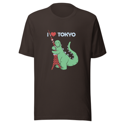 Funny cartoon monster hugging the Tokyo Tower under an “I Love Tokyo” sign. Retro-style parody artwork with vintage textures and playful giant-creature humor.