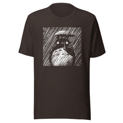A large forest spirit stands still in the rain, holding a tiny umbrella while soaking in the storm. This black and white design captures a quiet, emotional moment with a vintage, textured style.