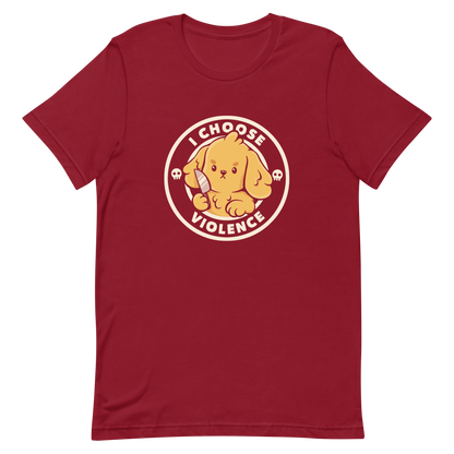 A cute yellow cartoon dog holds a small knife, surrounded by a circular logo that reads 'I Choose Violence'. The dog's expression is serious, yet the overall style is playful and cute. Two small skull icons are on either side, adding an ironic tone to the cheerful design.