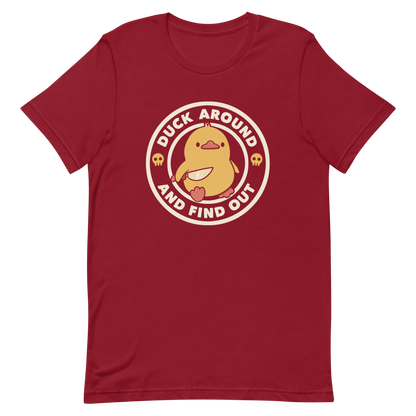 A cute yellow duck holding a small knife, around it the text "Duck Around And Find Out". An art that mixes humor with the temperament of ducks.