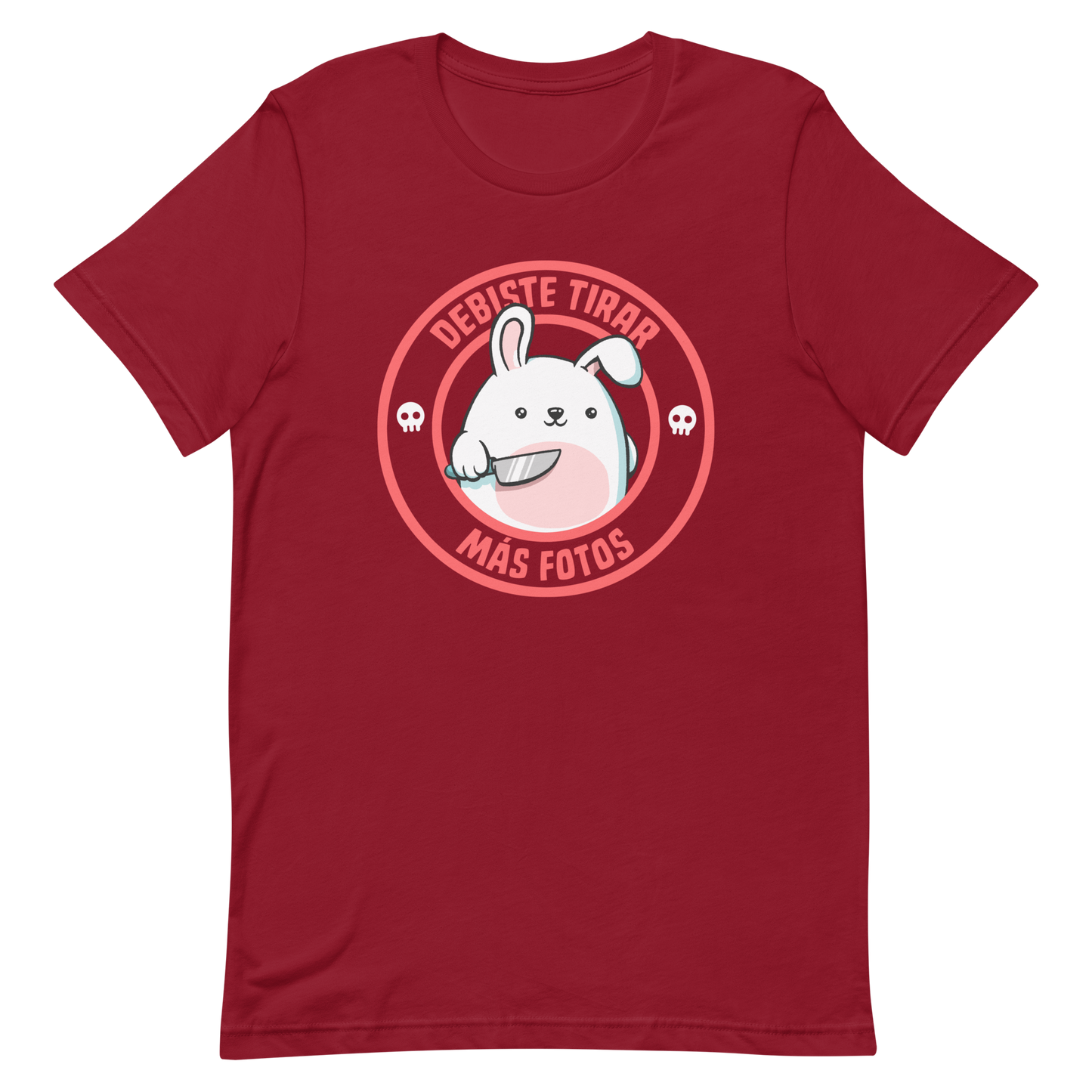A cute white cartoon bunny with a pink belly stands holding a large kitchen knife in one paw. Surrounding the bunny is a red circular border with the words 'DEBISTE TIRAR MÁS FOTOS'. Small skull icons are on either side of the circle. The overall tone is a mix of adorable and ironic humor.