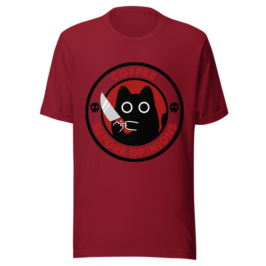 The illustration, in shades of red and black, features a wide-eyed black kitten holding a knife at the centre. Surrounding the cat is the phrase ‘Coffee Before Opinions’. A fun and cheeky gift for those who love cats and can’t function without their coffee.