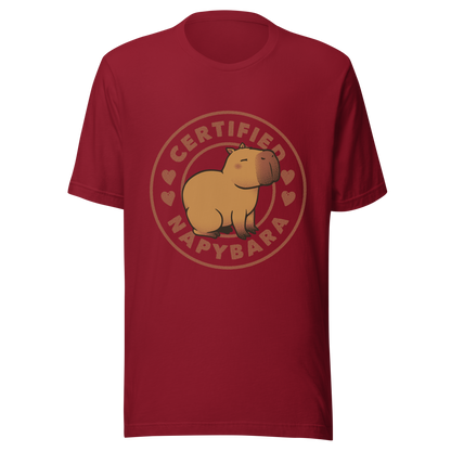 An art piece in warm beige and brown tones featuring a relaxed, sleepy capybara sitting peacefully beside the phrase “Certified Napybara”. A cozy, humorous design perfect for anyone who relates to slow days, loves capybaras, and fully embraces the art of taking naps.
