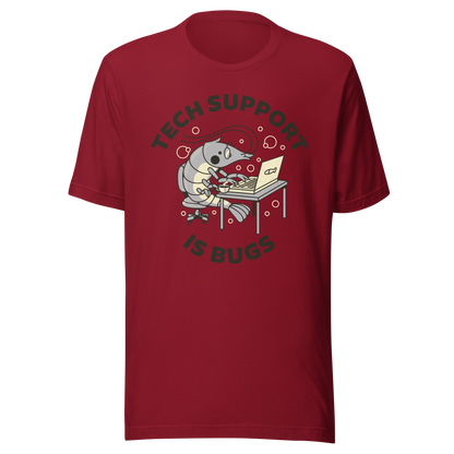 A cute shrimp sits at a desk, typing on a laptop while surrounded by the phrase “Tech Support Is Bugs”. This design is a humorous visual pun about coding bugs, blending marine life with developer culture in a lighthearted way. Perfect for programmers, tech nerds and anyone who lives between coffee cups and lines of code.