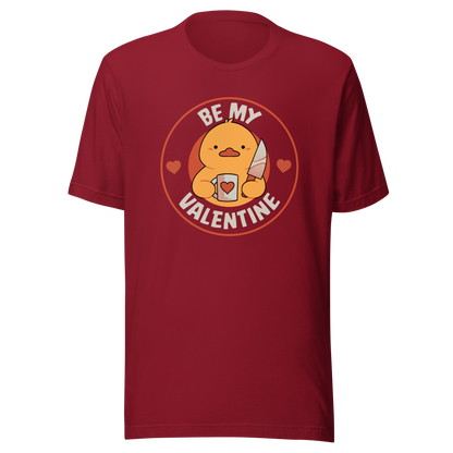 A cute duckling holding a heart-shaped coffee mug and a small knife, paired with the phrase ‘Be My Valentine Funny Duck’. A playful mix of cuteness and dark humor, perfect for coffee lovers and fans of ironic, quirky art.