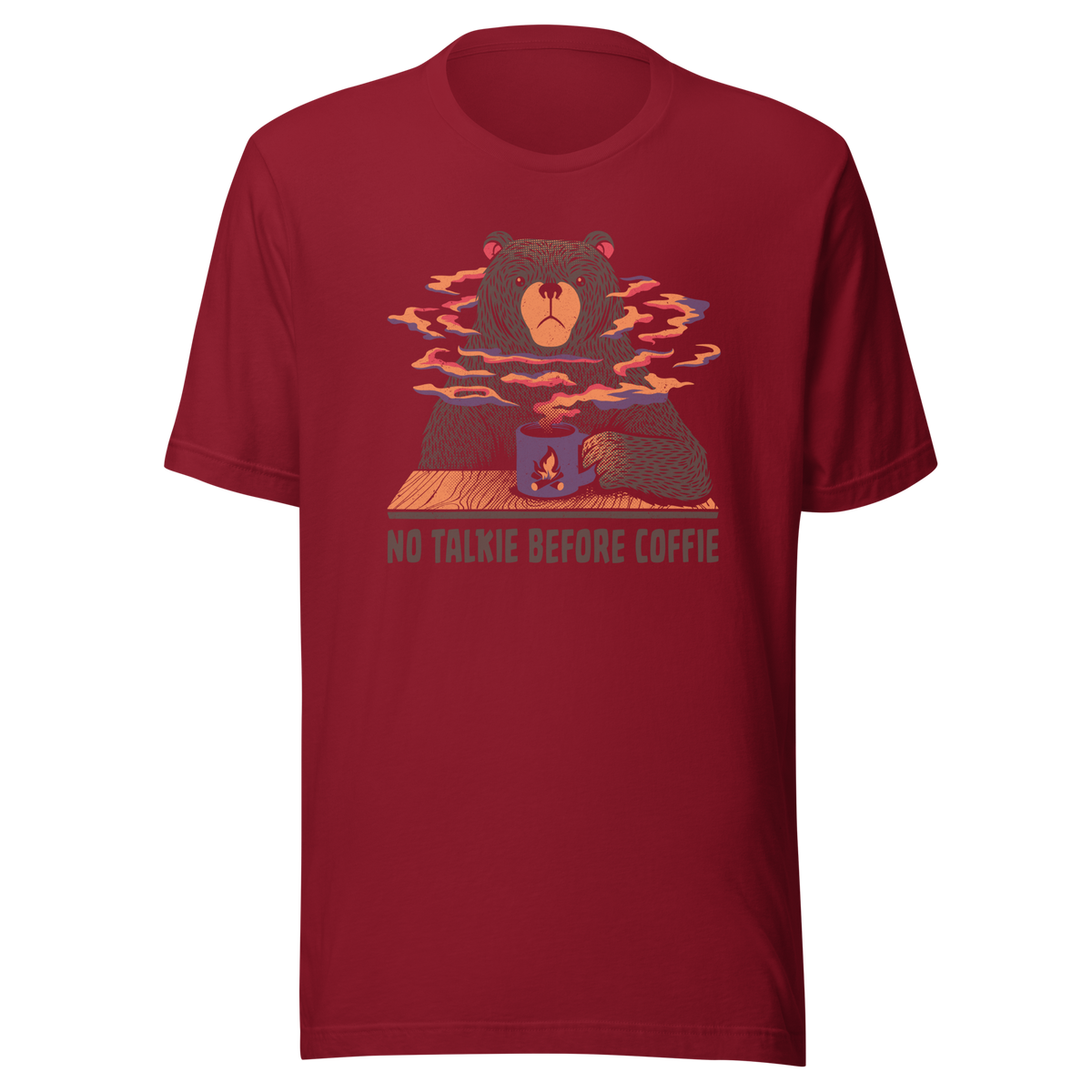 A large brown bear holding a purple coffee cup with a campfire design, with steam rising as if the coffee were piping hot. Below it appears the phrase ‘No Talkie Before Coffie’. A fun design for coffee lovers and anyone who isn’t ready to talk before their first cup.