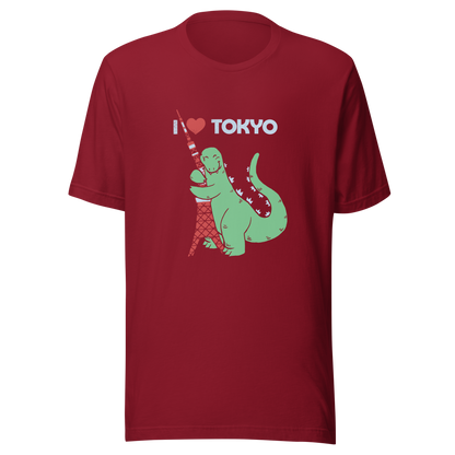 Funny cartoon monster hugging the Tokyo Tower under an “I Love Tokyo” sign. Retro-style parody artwork with vintage textures and playful giant-creature humor.