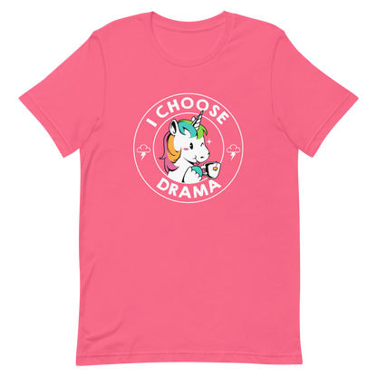 A cartoon unicorn with rainbow-colored mane holds a cup of tea and a heart, encircled by the words 'I Choose Drama'. Two small clouds with lightning bolts flank the unicorn, adding a playful yet slightly edgy vibe. The design is bold and whimsical with a pop-art influence.