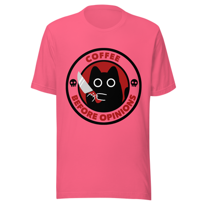 The illustration, in shades of red and black, features a wide-eyed black kitten holding a knife at the centre. Surrounding the cat is the phrase ‘Coffee Before Opinions’. A fun and cheeky gift for those who love cats and can’t function without their coffee.
