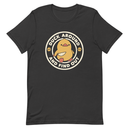 A cute yellow duck holding a small knife, around it the text "Duck Around And Find Out". An art that mixes humor with the temperament of ducks.
