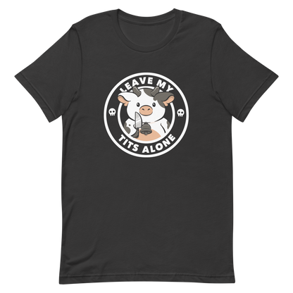 A quirky stamp-style design featuring a cute spotted cow holding a knife with the phrase “Leave My Tits Alone.” It mixes humor, attitude, and a playful call for animal respect. Perfect for cow lovers, fans of sassy humor, and anyone who supports animal rights.