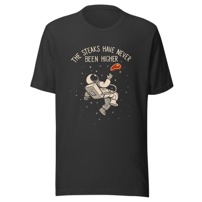 An astronaut floating through space with a small steak in front of him, paired with the phrase ‘The Steaks Have Never Been Higher’. A playful and humorous design that blends space exploration with a clever visual pun. Perfect for fans of witty wordplay and quirky art.