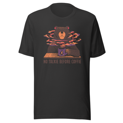 A large brown bear holding a purple coffee cup with a campfire design, with steam rising as if the coffee were piping hot. Below it appears the phrase ‘No Talkie Before Coffie’. A fun design for coffee lovers and anyone who isn’t ready to talk before their first cup.