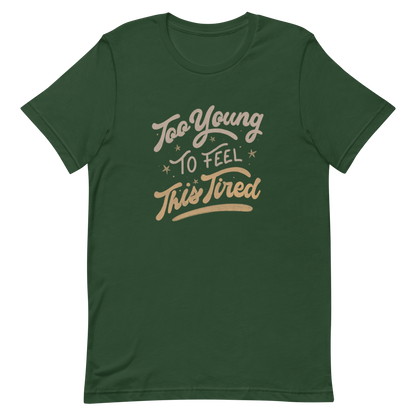 The artwork features the vintage-style lettering "Too Young To Feel This Tired," with touches of beige and gold, decorated with small stars. This playful phrase conveys the feeling of premature fatigue with an ironic and stylish touch. Ideal for young adults, students, and anyone who can relate to the daily struggle between energy and exhaustion.