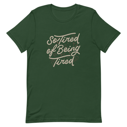 The artwork features the retro-style lettering "So Tired of Being Tired" surrounded by small icons like stars, hearts, clouds, and spider webs. This composition expresses the feeling of constant fatigue in a fun and stylish way. Ideal for those who bring humor to life and those who experience exhaustion in a lighthearted and humorous way.