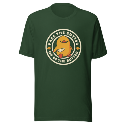 A yellow duckling holding a butter knife in a cute pose, around him the phrase "Pass the butter or be the butter". An art with a lot of humor for those who love ducks.