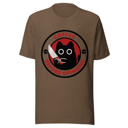The illustration, in shades of red and black, features a wide-eyed black kitten holding a knife at the centre. Surrounding the cat is the phrase ‘Coffee Before Opinions’. A fun and cheeky gift for those who love cats and can’t function without their coffee.