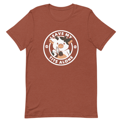 A quirky stamp-style design featuring a cute spotted cow holding a knife with the phrase “Leave My Tits Alone.” It mixes humor, attitude, and a playful call for animal respect. Perfect for cow lovers, fans of sassy humor, and anyone who supports animal rights.