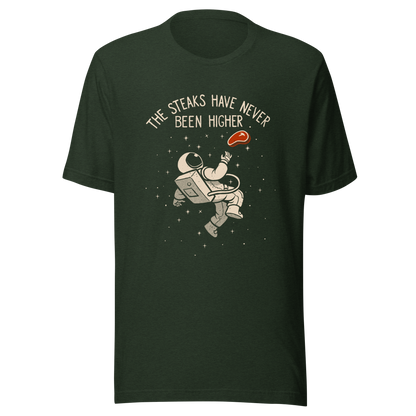 An astronaut floating through space with a small steak in front of him, paired with the phrase ‘The Steaks Have Never Been Higher’. A playful and humorous design that blends space exploration with a clever visual pun. Perfect for fans of witty wordplay and quirky art.