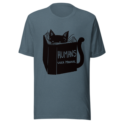 A kitten peeking out from behind a huge book titled "Humans: User Manual". This design plays on the idea that cats are trying to figure out how to control us. Perfect for cat lovers, book fans, and anyone who enjoys lighthearted humor in prints.