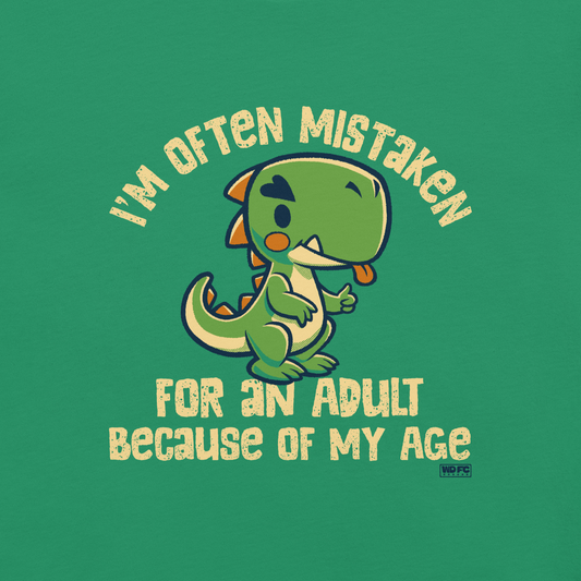 Cute cartoon dinosaur standing with a funny expression, accompanied by the humorous phrase “I’m Often Mistaken for an Adult Because of My Age” in bold distressed lettering.