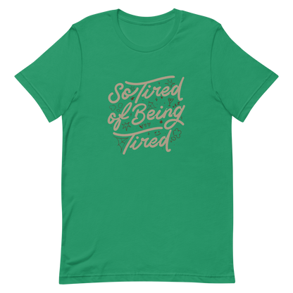 The artwork features the retro-style lettering "So Tired of Being Tired" surrounded by small icons like stars, hearts, clouds, and spider webs. This composition expresses the feeling of constant fatigue in a fun and stylish way. Ideal for those who bring humor to life and those who experience exhaustion in a lighthearted and humorous way.