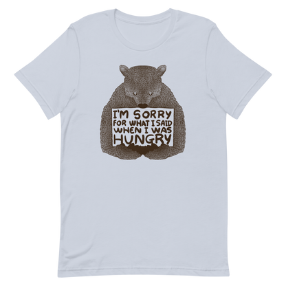 The image shows a humorous, detailed illustration of a bear, drawn in a hand-drawn style, holding a sign that reads 'I'm sorry for what I said when I was hungry.' The bear appears to be apologizing in a comical, endearing manner, making it a relatable and light-hearted design.
