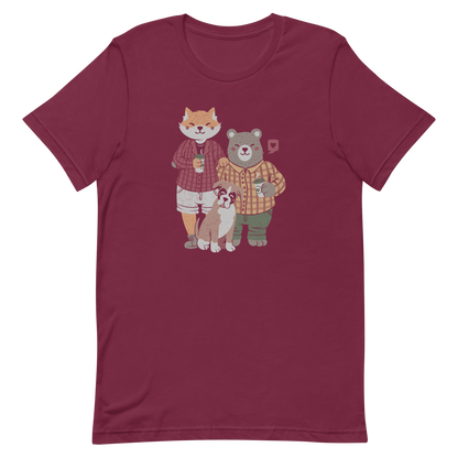 A beautiful family made up of a little red fox, a gray bear wearing plaid shirts and having a coffee with their boxer dog. An art that shows that families can be different what matters is love.