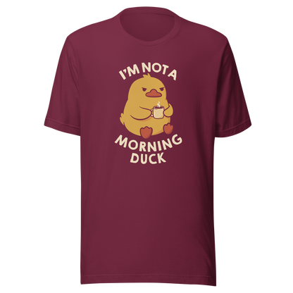A cute little yellow duck, with a grumpy face, holding a mug of coffee and surrounded by the words "I'm Not a Morning Duck". This design plays on the humor of difficult mornings, mixing cuteness and sarcasm for those who only function after coffee. Perfect for those who are not at all morning people, coffee lovers and fans of funny prints and cute ducks.
